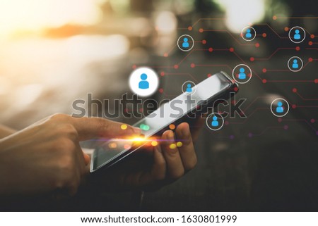 Woman hand using smart phone at coffee shop with people icon and line dot abstract background. Technology business and connect communication concept. Vintage tone filter effect color style.