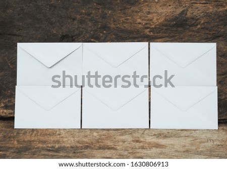 White business envelopes. set of letters envelopes isolated on wood background
