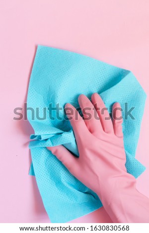 Cleaning set for different surfaces in kitchen, bathroom and other rooms. Empty place for text or logo on blue background. Cleaning service concept. Early spring regular clean up. Top view.Flat lay