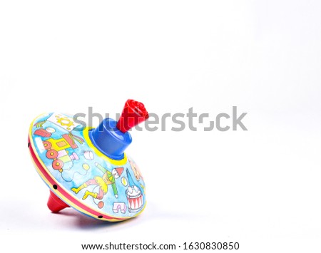 Toy Yula with pictures on a white background.spinning top