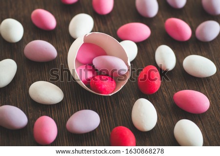 Flat Lay of multi-color Easter Eggs Pattern on wooden background. Easter background or easter concept. Happy Easter