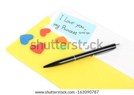 Note in envelope with pen isolated on white