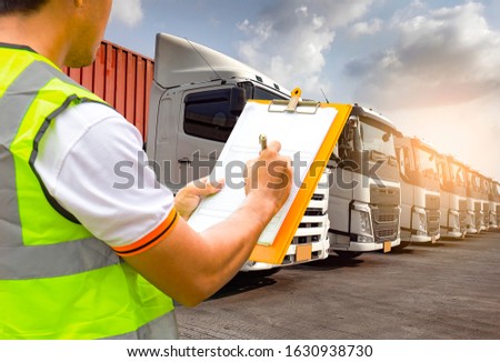 Truck Drivers Holding Clipboard the Control Loading Shipping Cargo Container. Truck Inspection. Semi Trailer Truck Cargo Freight Transport Logistics.	