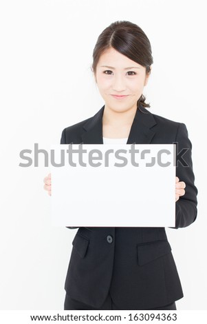 young asian businesswoman holding blank whiteboard