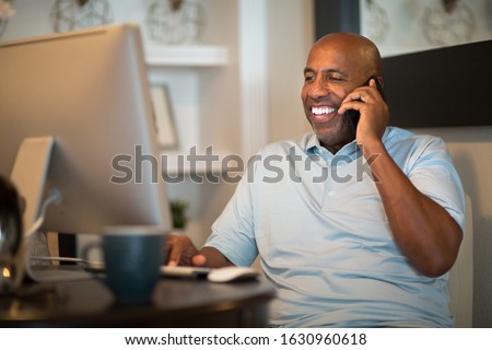African American man working from his home office.