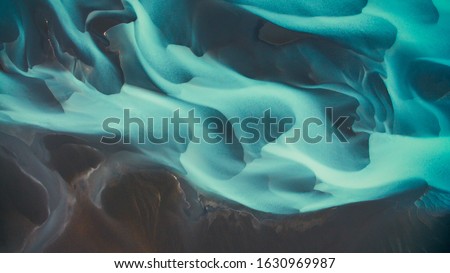 Aerial drone view of a huge riverbed and delta, glacial river system transporting deposits from the Solheimajokull glacier,Iceland Royalty-Free Stock Photo #1630969987