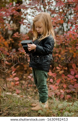 a little girl with a camera