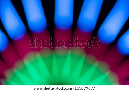 Colorful blur electric light on black background.