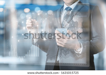 Businessman working in the interface on the virtual computer screen.