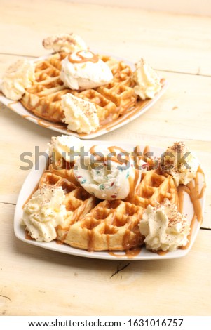 
Waffle with vanilla ice cream, delicious chantilly cream and caramel