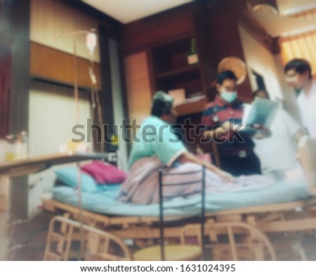 The doctor examined the condition of the patient in the hospital,blur