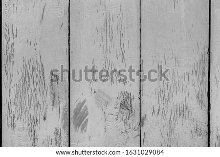 Splintered grained fence panel. Grungy uneven surface white painted. Rural town buildings of cracked faded lumber. Bright cut sawn battens.Flaky structure ancient gate.Rustic garden loft for backdrop