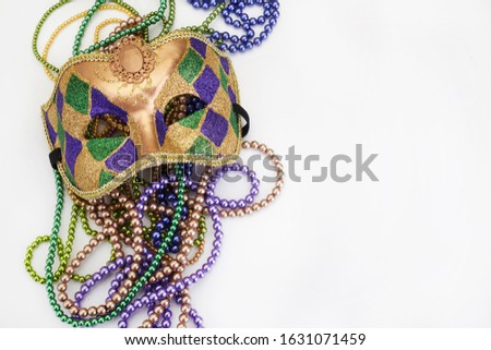 mask and beads for party