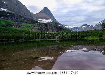 Reflection picture taken on a hike near the many glacier campgrounds. Glacier National Park is hands down on of the best places to hike and site see while life and amazing mountains.