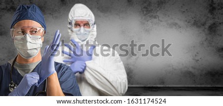 Female and Male Doctors or Nurses Wearing Scrubs and Protective Mask and Goggles Banner. Royalty-Free Stock Photo #1631174524
