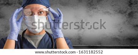 Female Doctor or Nurse Wearing Scrubs and Protective Mask and Goggles Banner. Royalty-Free Stock Photo #1631182552