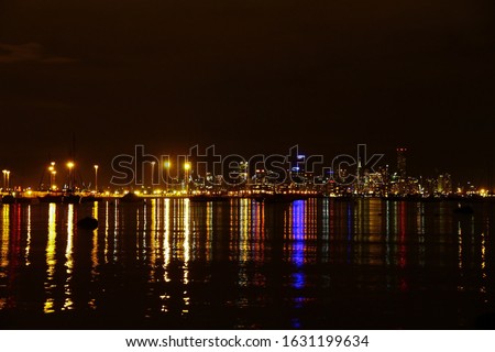 Melbourne city skyline at night with the lights over Port Phillip Bay