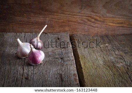 Garlic on a wooden background.