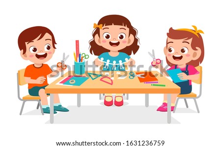 happy cute little kids boy and girl make paper craft