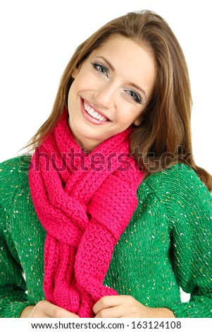 Beautiful smiling girl in warm knit scarf isolated on white