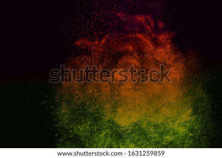  color powder explosion cloud isolated on black background. Freeze motion of color dust particles splashing. 