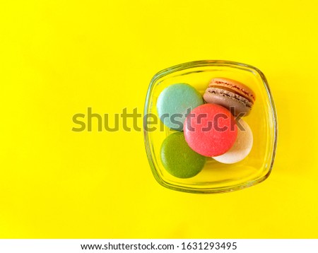 Colorful macarons dessert sweet beautiful to eat on glass bowl,food and drink concept