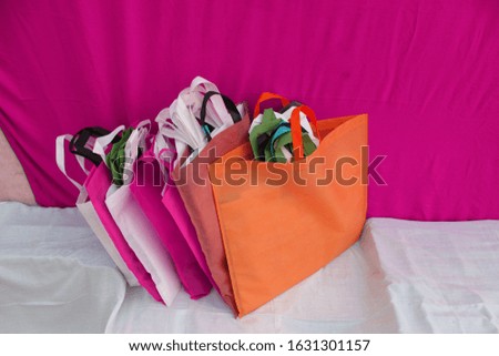 Beautiful Non Woven Polypropylene Fabric Shopping Bags with pink background
