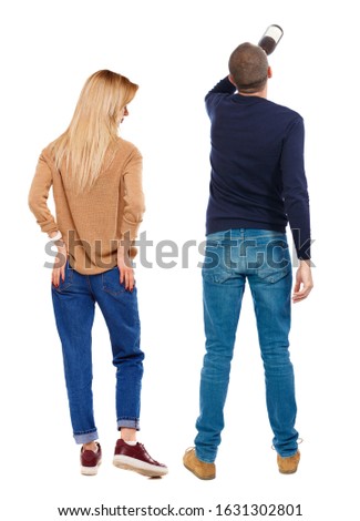 Back view of couple in sweater. beautiful friendly girl and guy together. Rear view people collection. backside view of person. Isolated over white background.