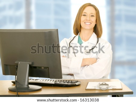 doctor woman sitting on her office with smile and looking to camera. computer set and clip board on her table