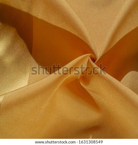 Texture, background, silk fabric, yellow amber. The photo is intended for, interior, imitation of a fashion designer, marketing, architecture, sketch, layout, surroundings