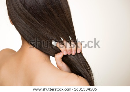 A woman who grabs her hair. Royalty-Free Stock Photo #1631334505