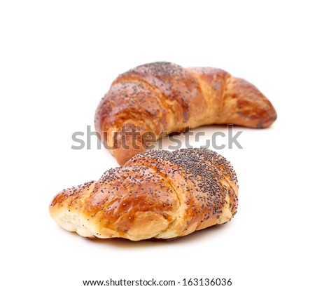 Appetizing croissants with poppy. Isolated on a white background.