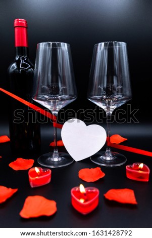 Valentines day celebration, two glasses with a black background
