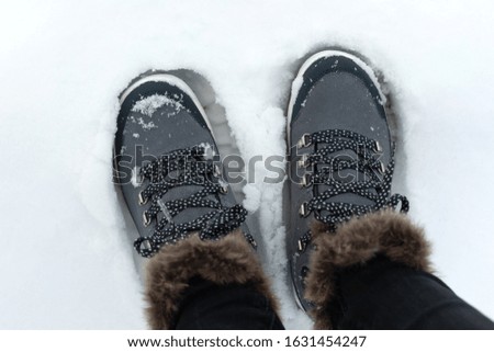 Picture of a comfortable women's warm boots in the snow
