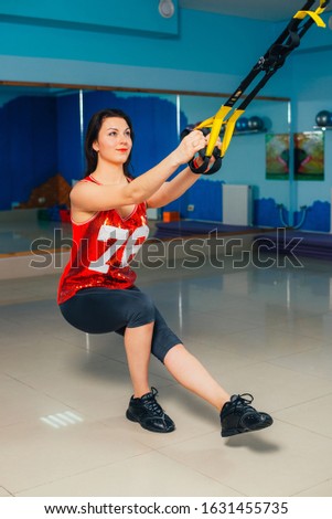 Healthy sports lifestyle. Athletic young woman in sports dress doing fitness exercise. 