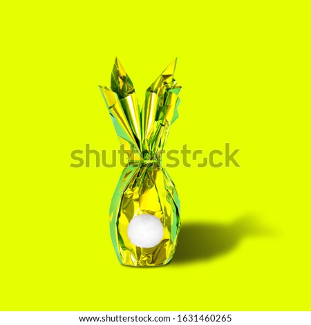 Easter eggs bunny on neon yellow pink background. Creative pop art Easter decoration