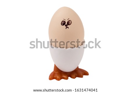 Egg whith drawn angry face isolated on white background. Easter concept 