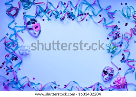 carnival colorful items and confetti, top view of masks with copy space