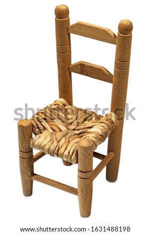 Old and vintage wooden chair with straw seat isolated on white background