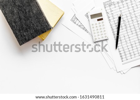 Financial literature. Books near documents, calculator on white background top-down copy space