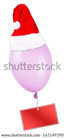Empty card hanging on color flying balloon with santa hat
