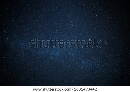 A low-angle shot of a starry night sky