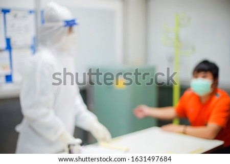 Blurry image of people using health masks to prevent the spread of the corona virus(2019 conv).
Chinese scientist and paramedics working hard to relocated 2019 conv virus suspect.

