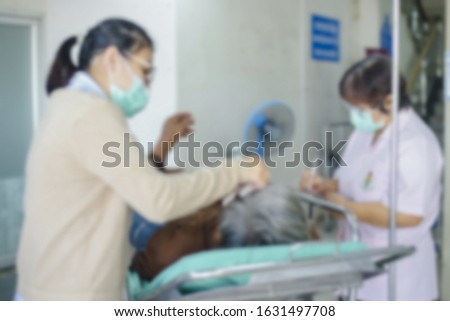 Blurry image of people using health masks to prevent the spread of the corona virus(2019 conv).
Chinese scientist and paramedics working hard to relocated 2019 conv virus suspect.

