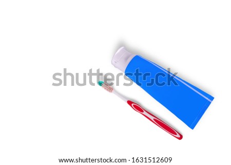 Toothbrush and toothpaste isolated on white background.
