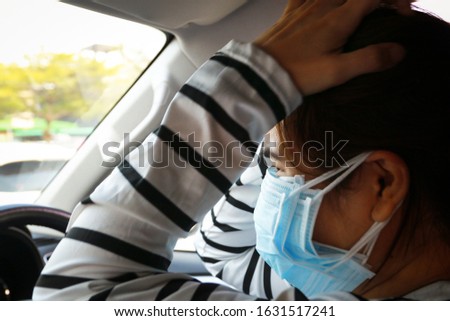 Stressed asian woman with many layer masks on her face,worried about illness,afraid of Coronavirus COVID-19 pandemic,tension,anxiety female people wearing multiple layers of medical protective mask