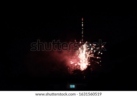 firework in blurred focus. black background 