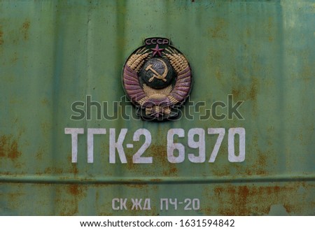 Old coat of arms of the Soviet Union on a railway carriage abbreviation TGK2 6970 
which means the translation: "Soviet shunting and industrial diesel locomotive with hydraulic transmission" 