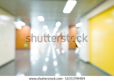 Blurred hospital corridor for background.