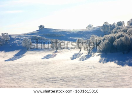 The picture of a hill in white snowpl